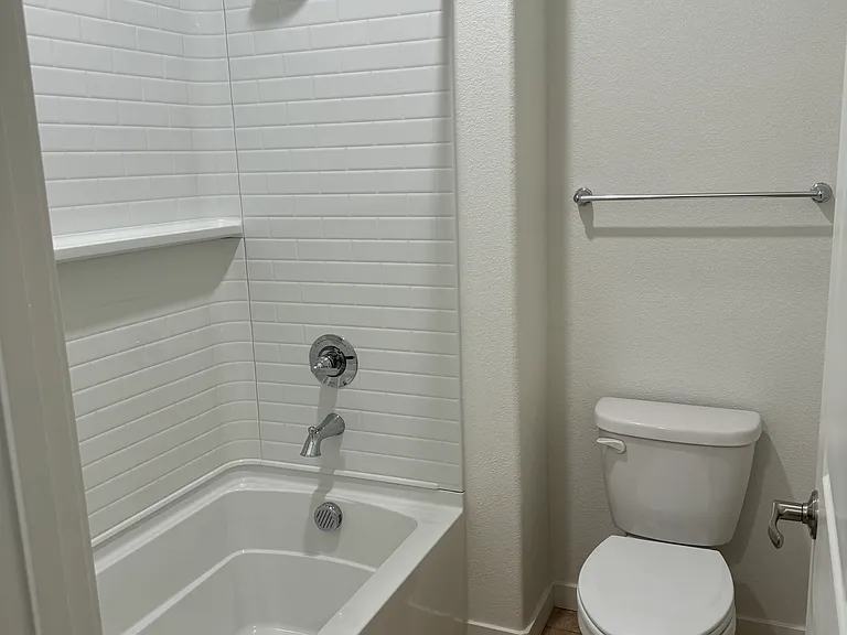 Guest restroom with bathtub full view