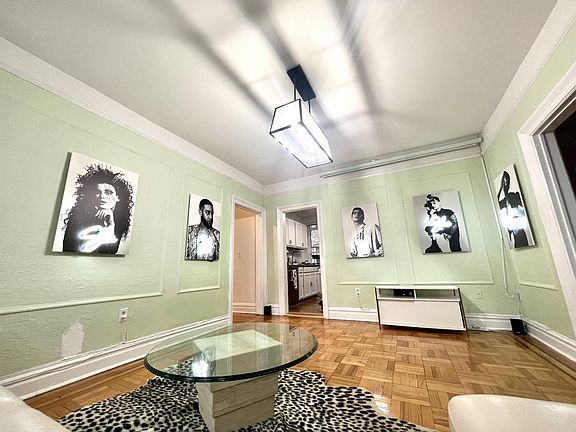 Included: Leather L shaped Couch, Neon Sign Photography installation, coffee table, TV Console, Rug, Large AC window unit (cools up all front rooms well), Curtains and curtain rod 

Not Included: N/A (everything shown included)