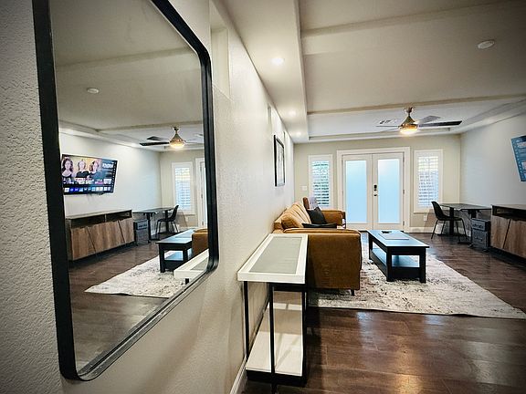 Mirror, kitchenette, plenty of seating, and a wonderful mounted SmartTV & worskpace (angle it any direction you want)