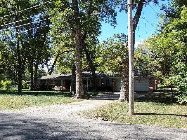 Brick home on acre lot.