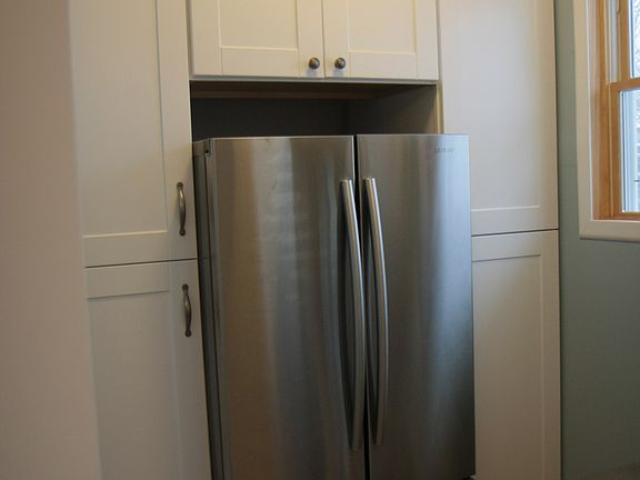 French Door Fridge and pantries with custom slide out shelve