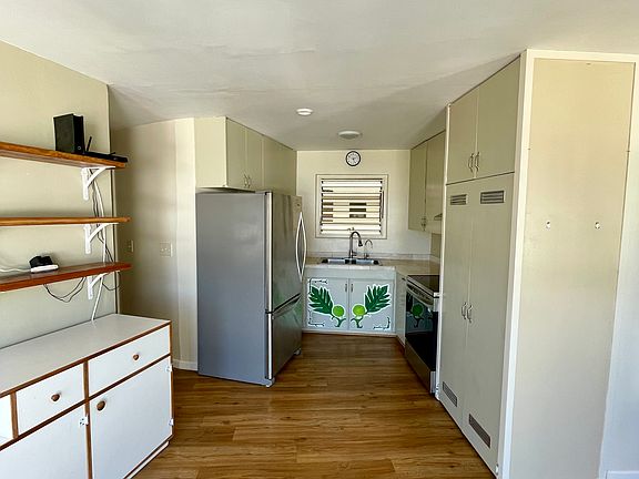 View from Dining Room windows, towards the kitchen and center of building (stove is less than a year old and fridge is less than 3 years old)