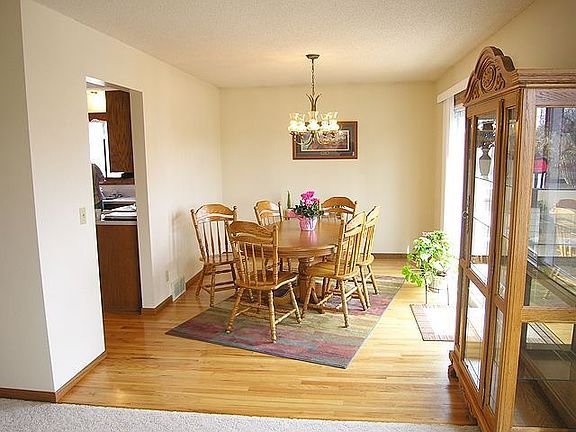Dining room has hardwood floors and deck access