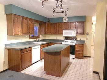 Fully applianced kitchen includes an island