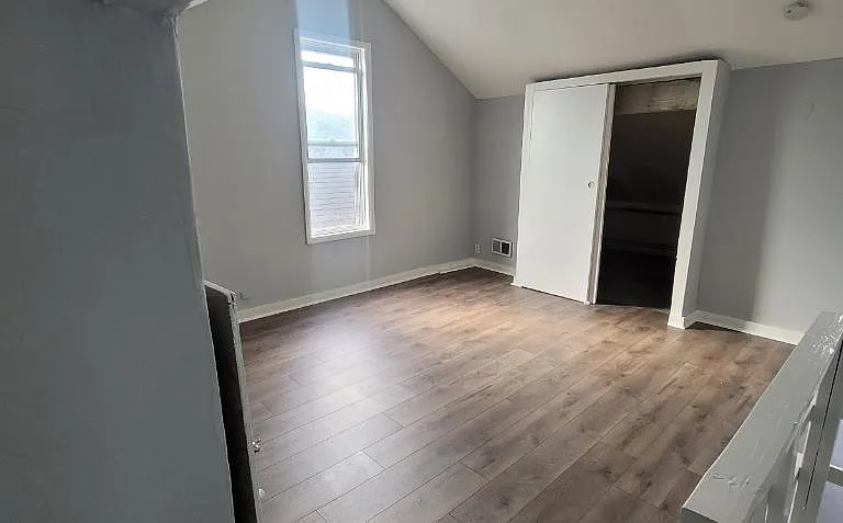 Bedroom #4 (attic) with vaulted ceilings and additional storage space