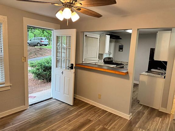 Front door into living room with view to kitchen