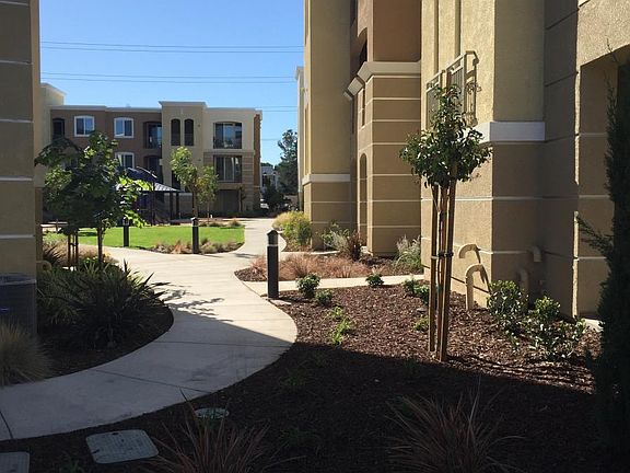 EXTERIOR BUILDING LEADING TO GREEN AREA