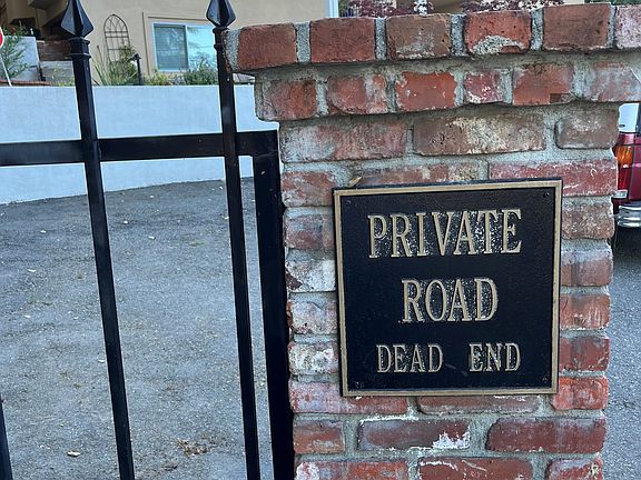 Entering private road off San Juan Rd. Cottage is quietly tucked behind this private home.