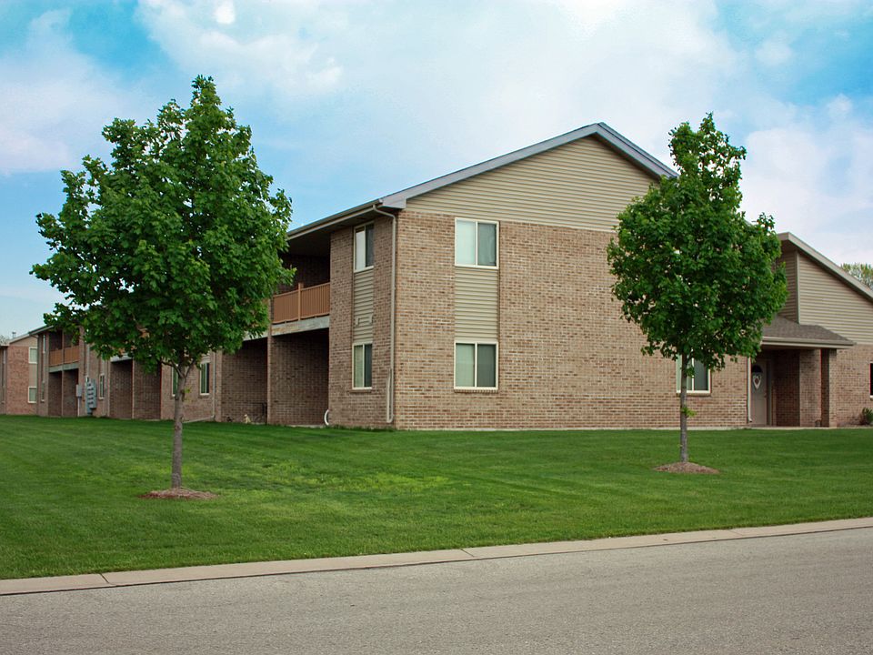 Back of building with patios on lowers and decks on uppers