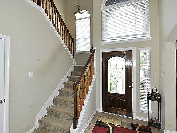 Two story foyer entrance! All tile downstairs in heavy traffic areas; dining & master bedroom have carpet.