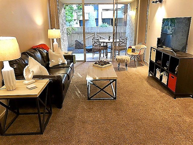 Living Room - TV and sliding doors to your private patio.