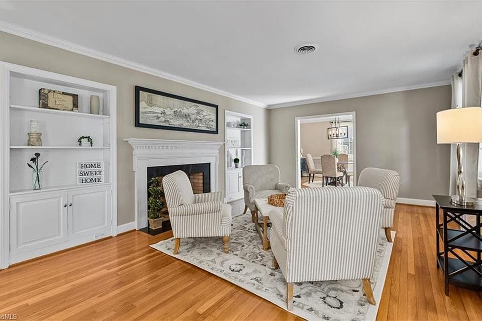 A Living Room With Furniture And Wooden Floor Greensboro: Stylish & Cozy Ideas