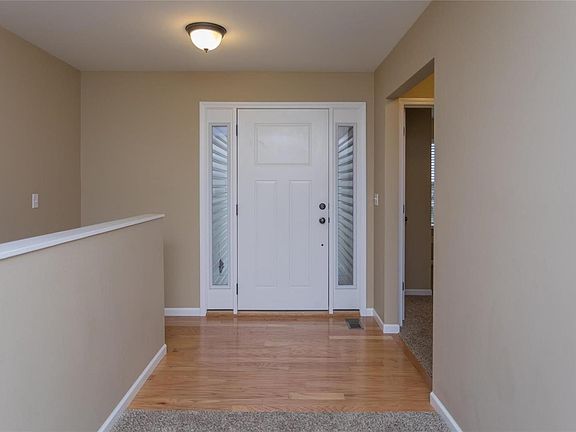 Wide wood floor entry, Bedrooms, Living area or down to the finished basement.