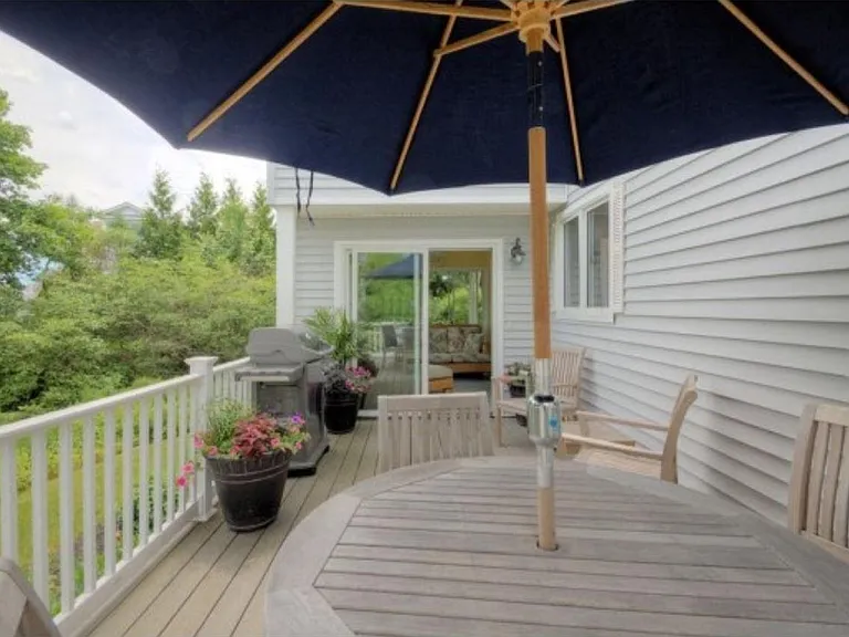 Private deck with teak furniture and gas Weber grill