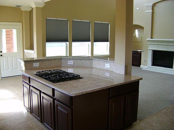 HUGE GRANITE ISLAND IN KITCHEN