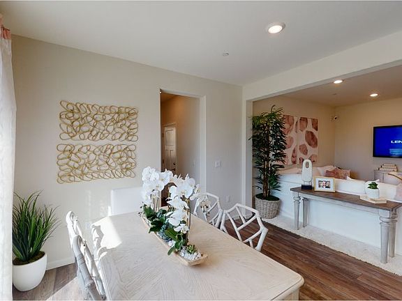 Situated conveniently off the entry, the family room serves as a natural space for gathering with lo