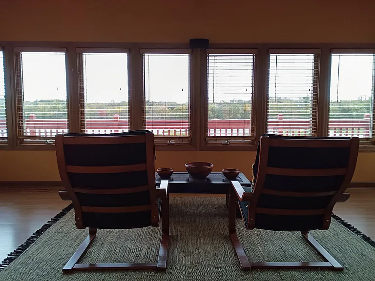 Unbeatable unobstructed 14 window view of the Maumee River and large wooden deck with seating outside