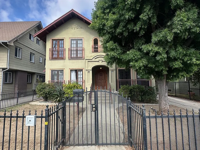Front of building with metal gate