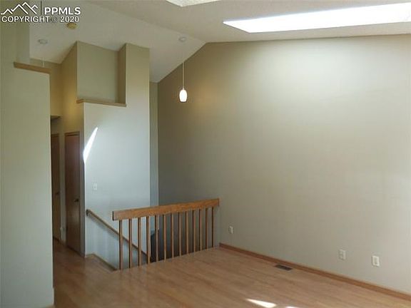 Another view of the living room with access to the basement.