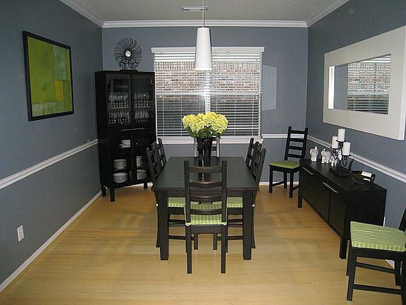 Formal Dining has bamboo floor, contemporary light fixture and measures 12x11