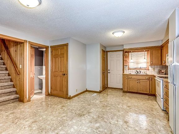 Large open kitchen with hardwood cabinets with updated appliances.
