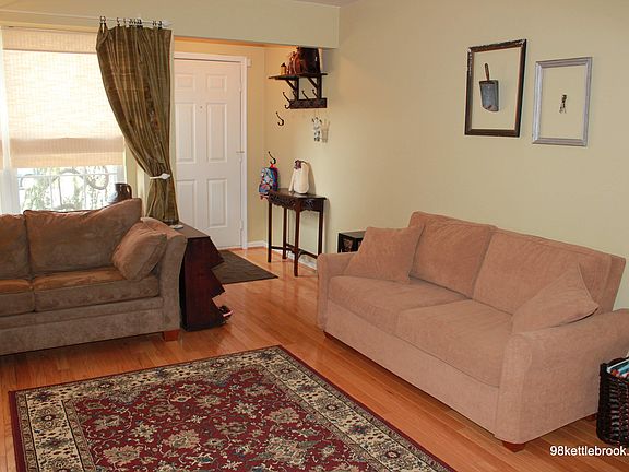 Open entrance & LR features 3 windows and hardwood flooring.