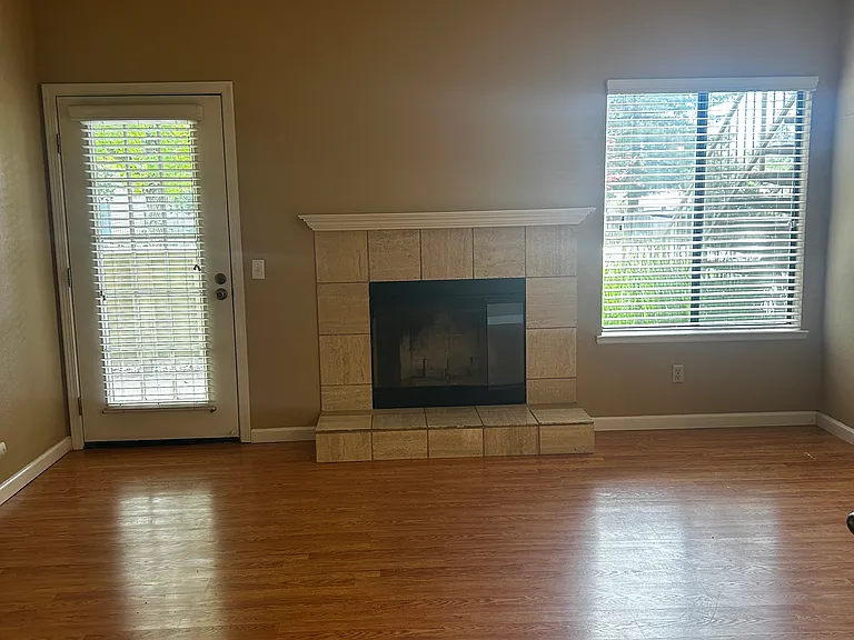 Wood Burning Fireplace, Laminate floors, French Door to patio!