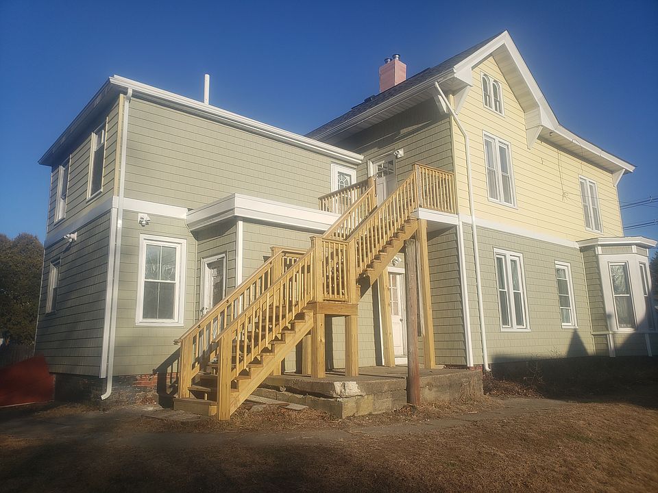 Rear of house, stairs lead to 2nd floor apartment for rent, There are also interior stairs in the front