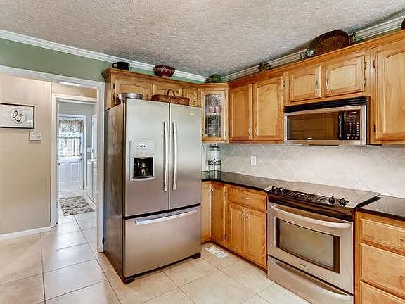 Fabulous kitchen with granite counter tops, plenty of cabinets & counter space.