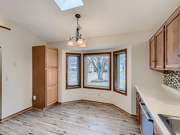 Nice kitchen nook looking into the front yard with a beautiful maple tree.