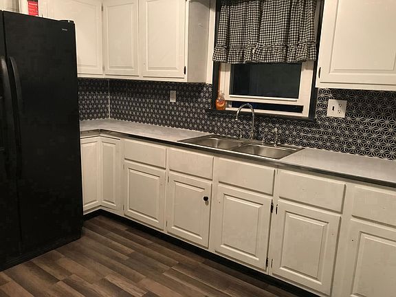 New floors, renovated cabinets, new sink and backsplash