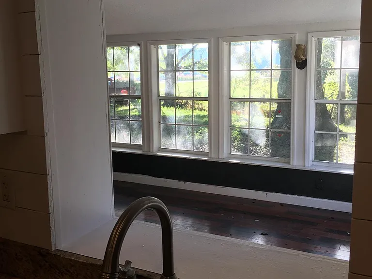 Looking into bonus/playroom/sunroom from kitchen pass through