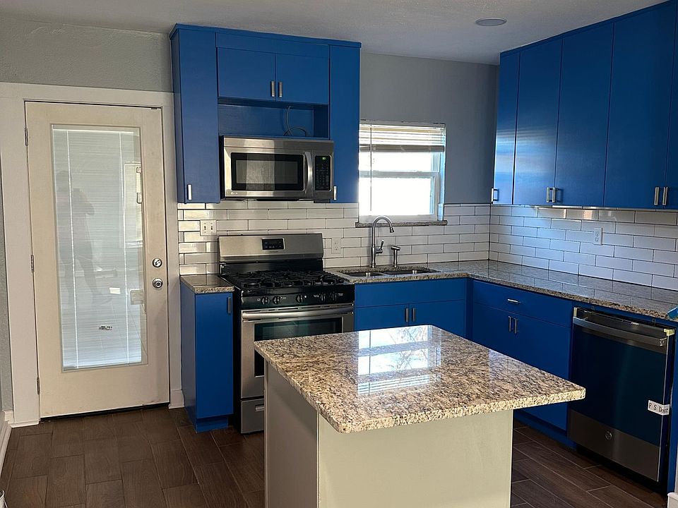 Updated kitchen with new cabinets and granite counter tops with island. New stainless steel appliances.