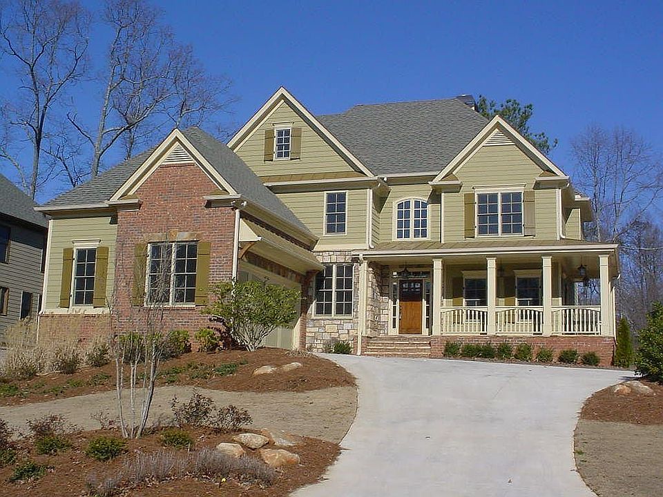 The Estes Park by Martin McWhorter Custom Homes offers a wrap around porch.