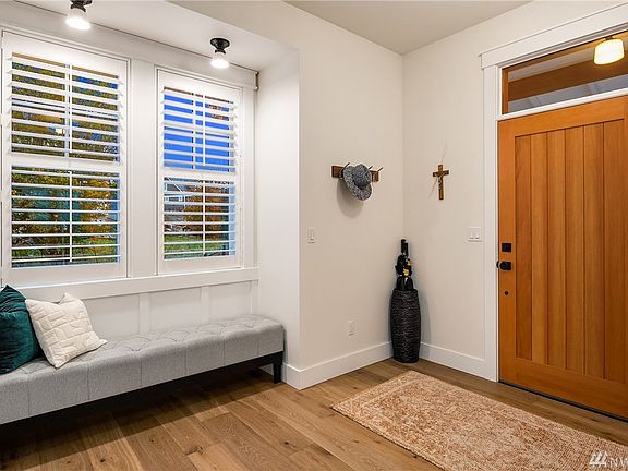 Wide plank white oak floors invite you into this thoughtful floorplan