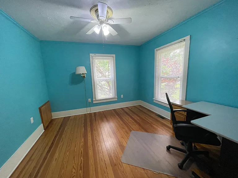 Second bedroom or office with plenty of natural light.