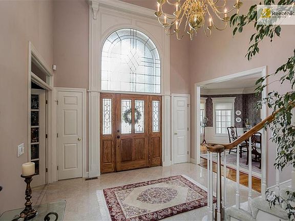 ENTER INTO THE TWO STORY MARBLE ENTRYWAY, LIBRARY & DINNING ROOM OFF ENTRY