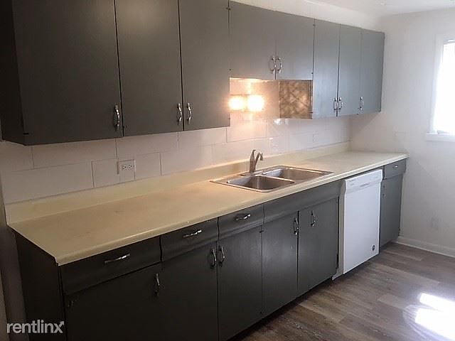 Remodeled kitchen - new dishwasher and new tiles and new lig