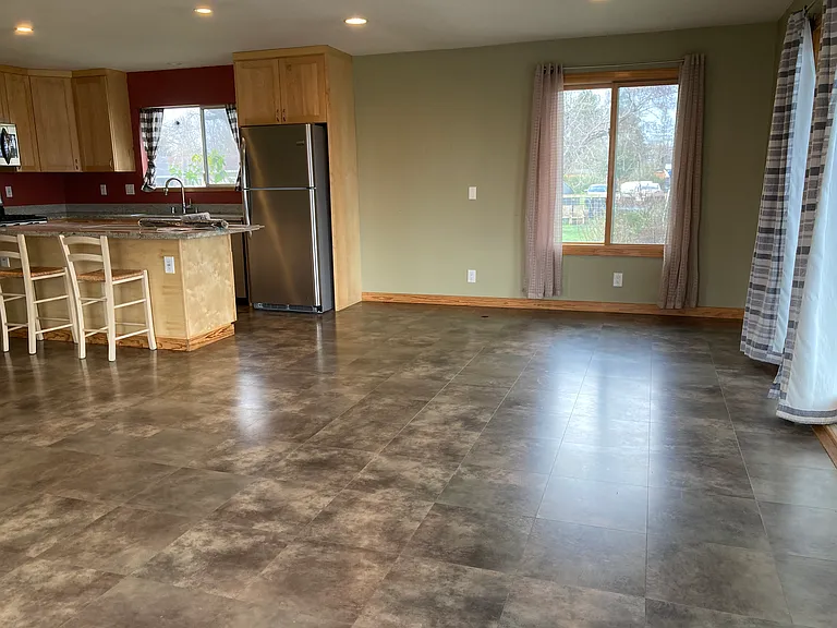 LR with looking into the dining area and kitchen.