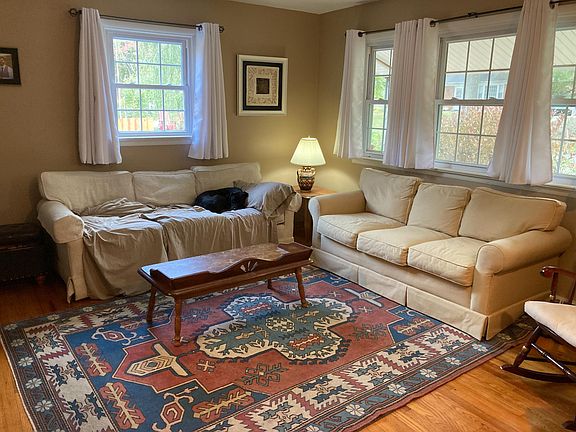 Living room. There is a coat closet in upper left corner.