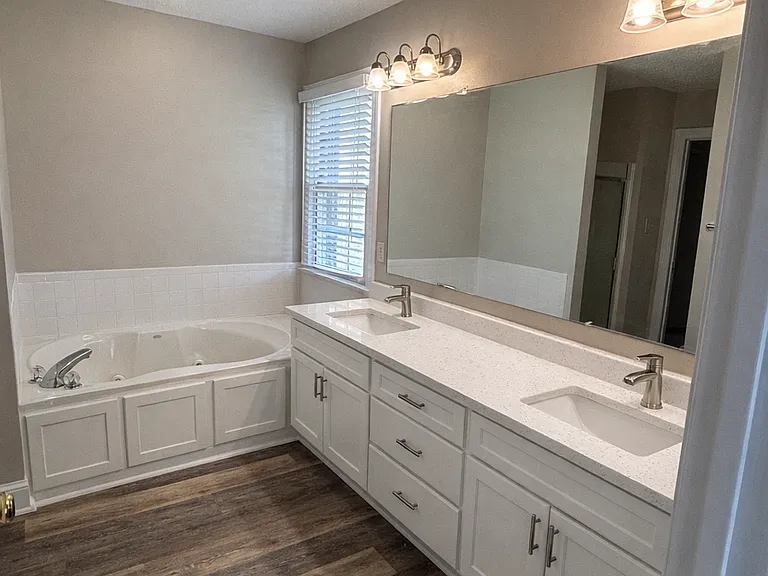 Primary Bath - double sinks, jetted tub, separate shower, w/c