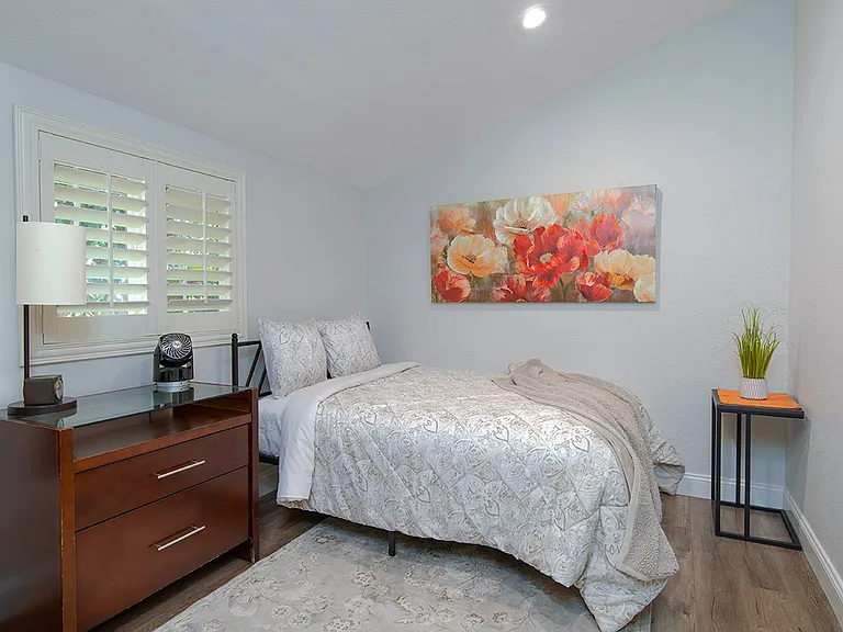 Second bedroom with full size bed and desk alternate view.