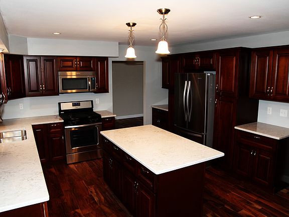 Custom Kitchen
						:
						Soft Close Drawers, Island, Quartz Countertops & New Appliances