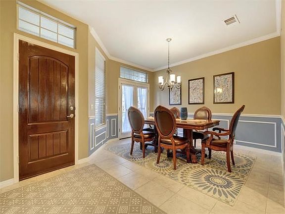 The front door opens to the foyer and formal dining room.