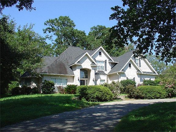 Well landscaped w/8-zone sprinkler system & mature oak trees.