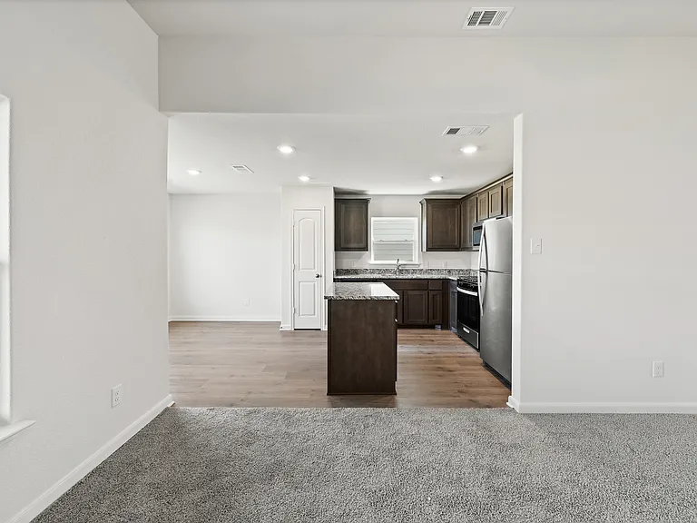 The family room has large windows that let in great, natural light and backyard views.
