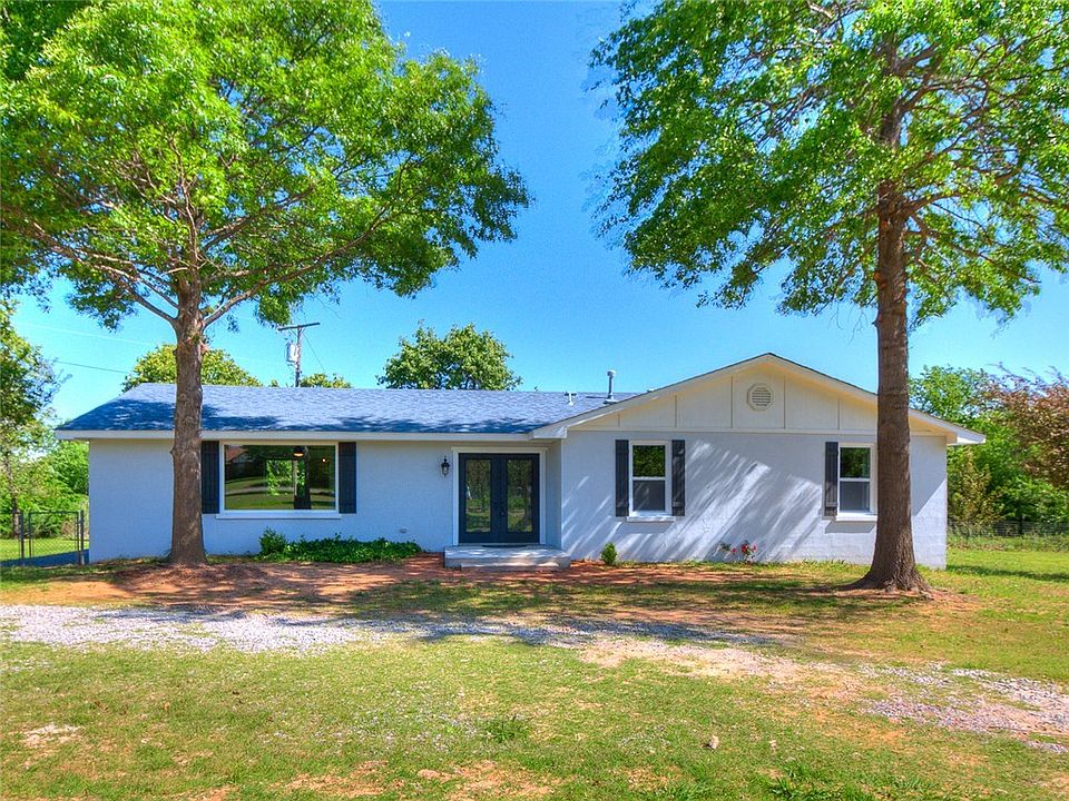 Nestled among mature trees in a quiet neighborhood.