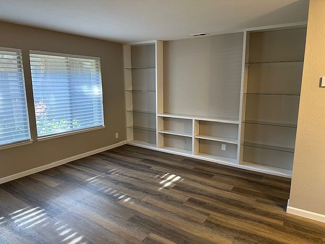 Spacious living room with built in shelves