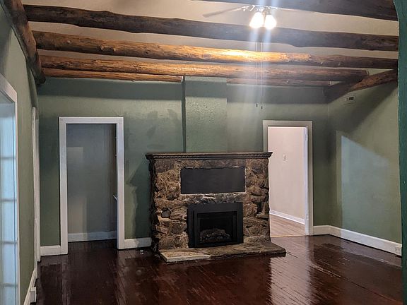 Large living room with vaulted ceiling and new natural gas fireplace insert