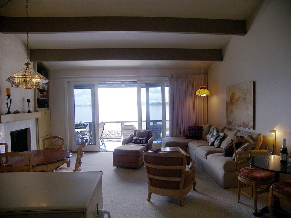 Entry level open floor plan. Lake views from kitchen, living and dining area.